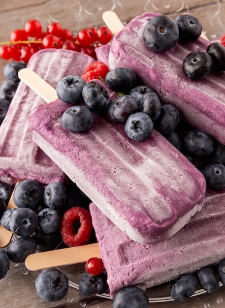 Delicious ice cream with forest fruits arrangement