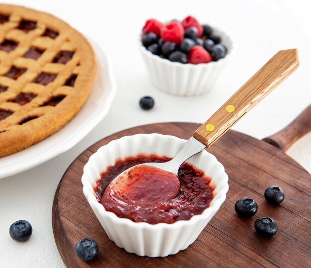 Delicious jam with spoon for pie