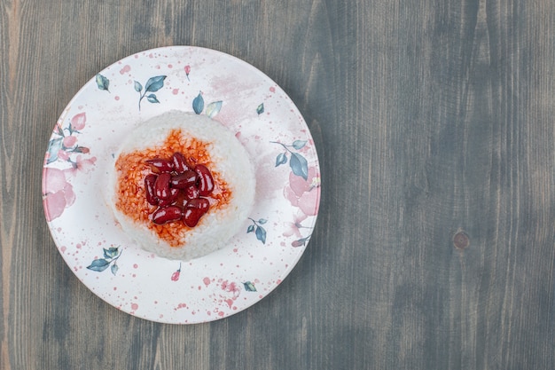 Delicious kidney beans with rice on a wooden table