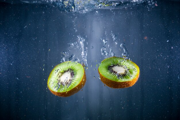 Delicious kiwis immersed in water