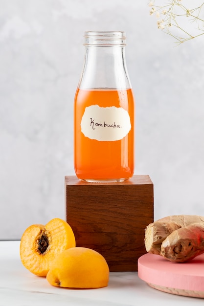 Delicious kombucha bottle and peach