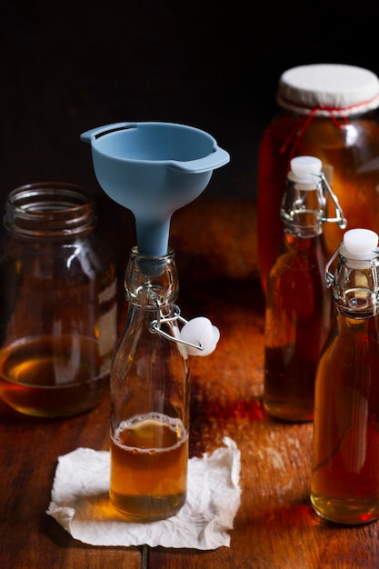 Free photo delicious kombucha bottle still life