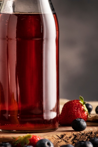 Delicious kombucha bottle and strawberry
