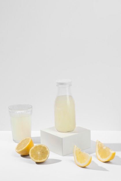 Delicious lemon juice bottle and glass