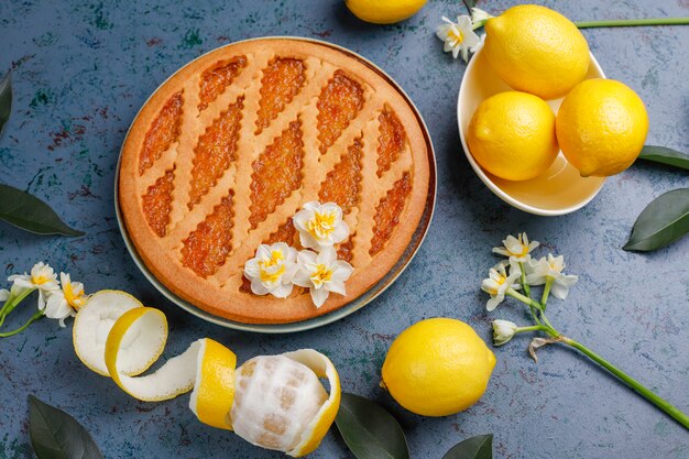 Delicious lemon pie with fresh lemons ,top view