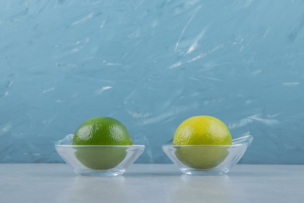 Delicious lime fruits in glass bowls