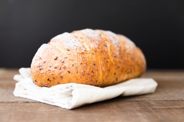 Free photo delicious loaf of bread with seeds on the table