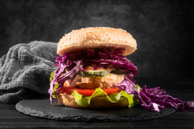 Delicious looking hamburger on black plate