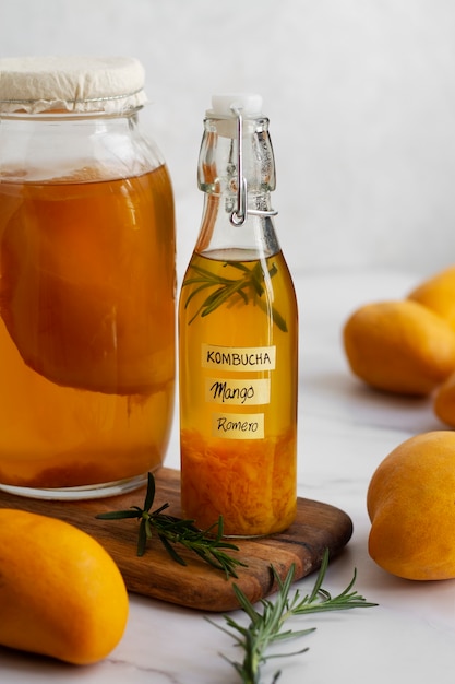 Delicious mango  kombucha bottle still life