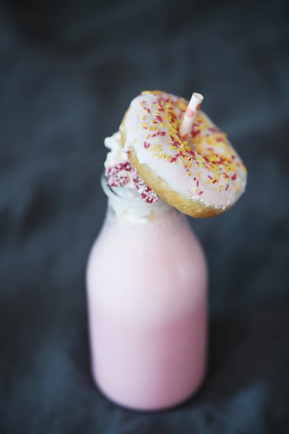 Delicious milkshake with donut