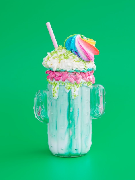 Delicious milkshake with green background