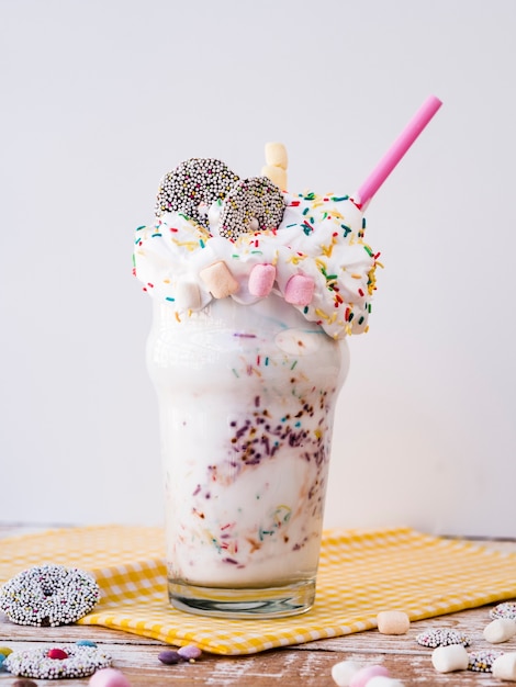 Free photo delicious milkshake with marshmallow and whipping cream