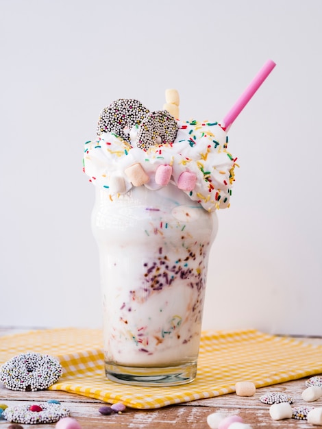 Delicious milkshake with marshmallow and whipping cream