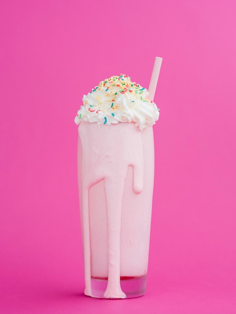 Delicious milkshake with pink background