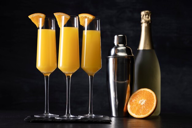 Delicious mimosa cocktail with orange slices