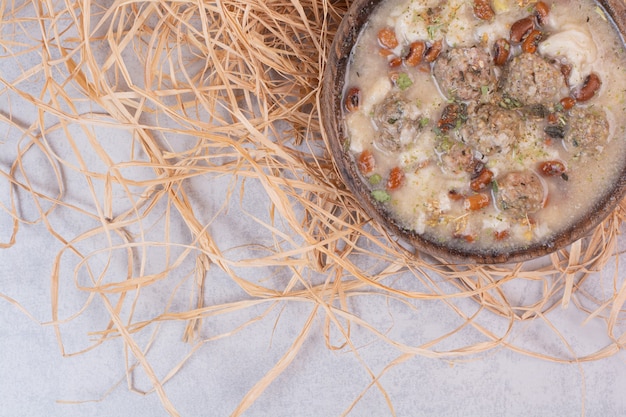 Free photo delicious mushrooms soup in wooden bowl