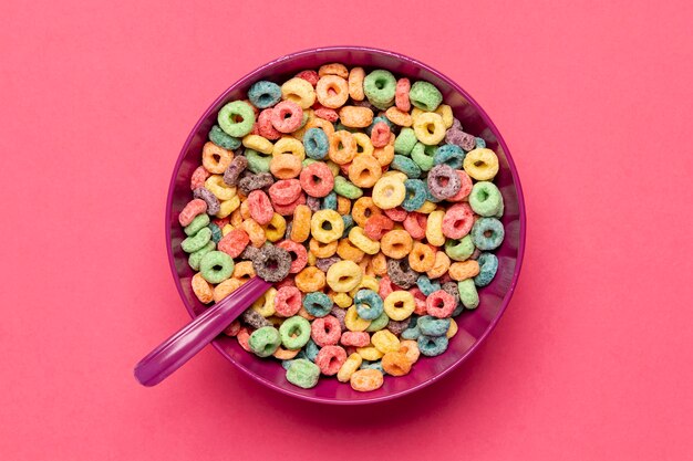 Delicious and nutritious fruit cereal loops flat lay