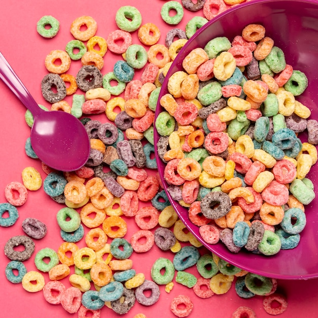 Free photo delicious and nutritious fruit cereal loops and spoon