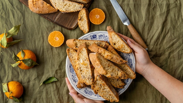 Delicious orange bun on table