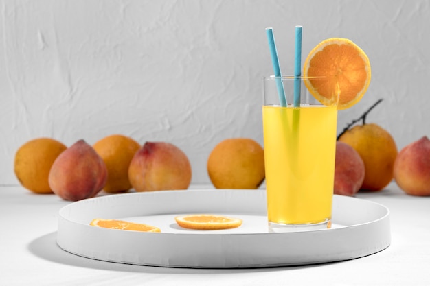 Free photo delicious orange drink with fruits