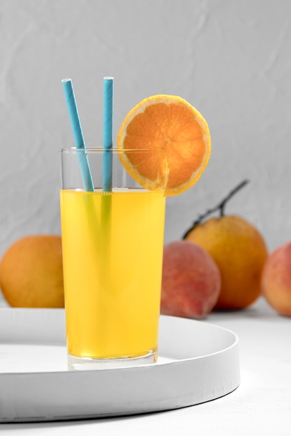 Delicious orange drink with straws