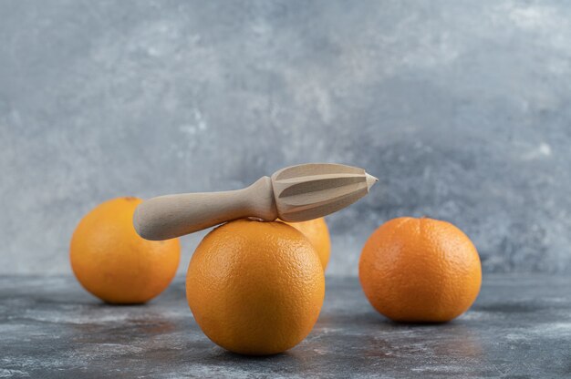 Delicious orange fruits on marble table. 