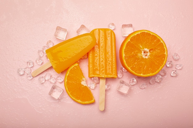 Free photo delicious orange ice cream pop stickles