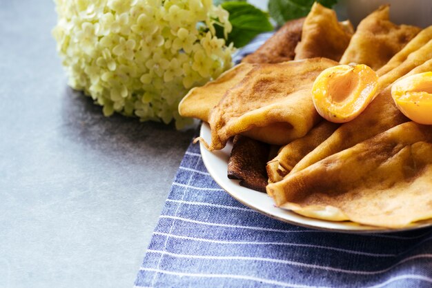 Delicious pancakes and apricot breakfast