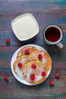 Free photo delicious pancakes with condensed milk.