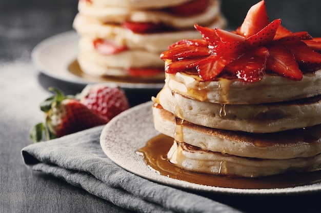 Delicious pancakes with fruit and honey