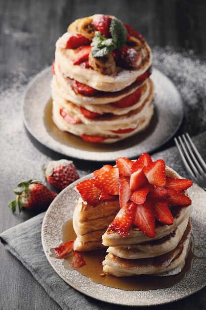 Delicious pancakes with fruit and honey