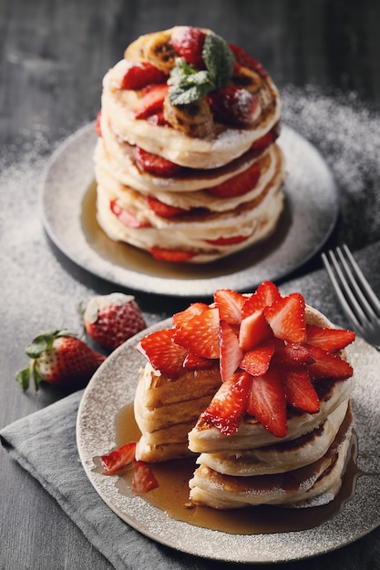 Delicious pancakes with fruit and honey