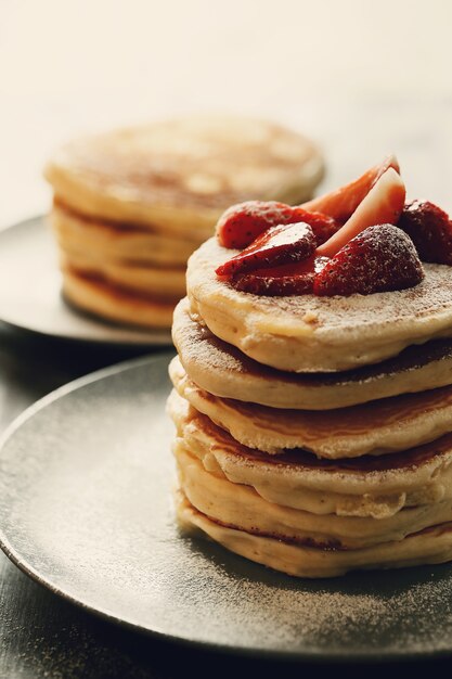 Delicious pancakes with strawberries