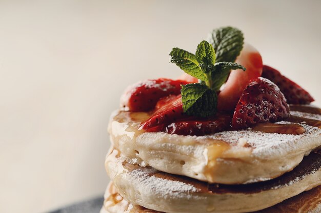 Delicious pancakes with strawberries