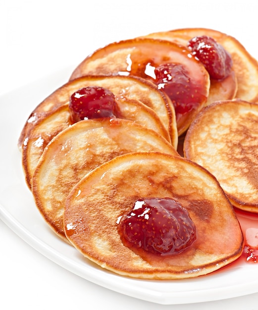 Delicious pancakes with strawberry jam