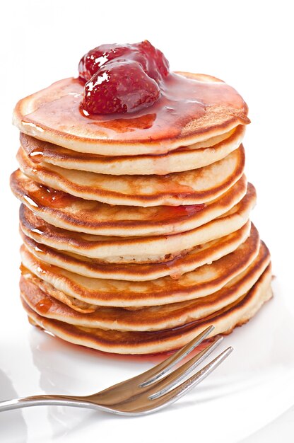 Delicious pancakes with strawberry jam