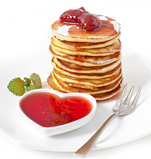 Delicious pancakes with strawberry jam