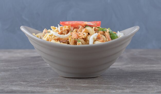 Delicious pasta with eggs in ceramic bowl.