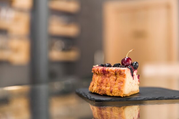 Delicious pastry on glass counter