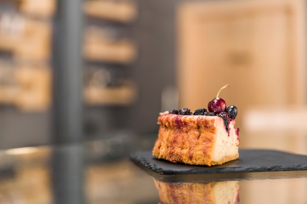 Delicious pastry on glass counter