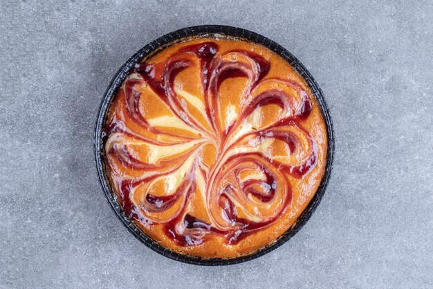 Delicious pie with berry on marble surface