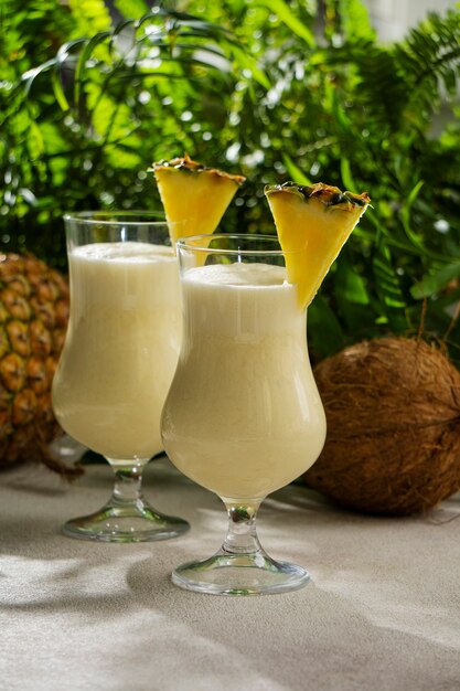 delicious pina colada cocktail  with leaves