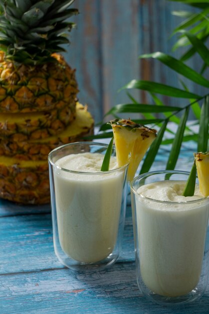 Delicious pina colada cocktail  with leaves