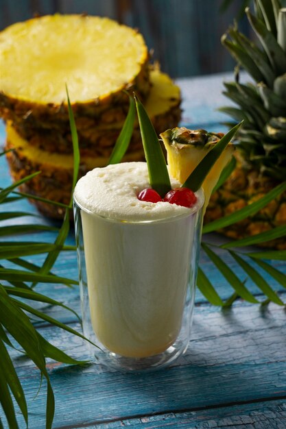 delicious pina colada cocktail  with leaves