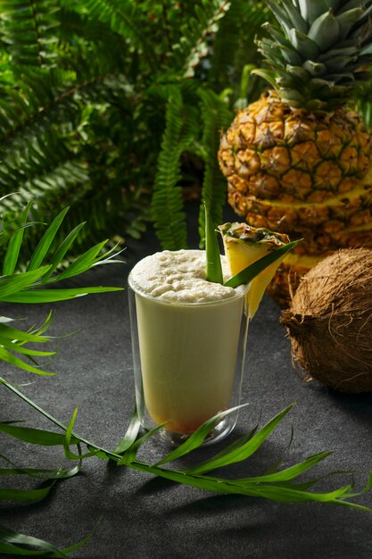 Delicious pina colada cocktail  with leaves