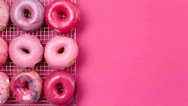 Free photo delicious pink donuts copy space