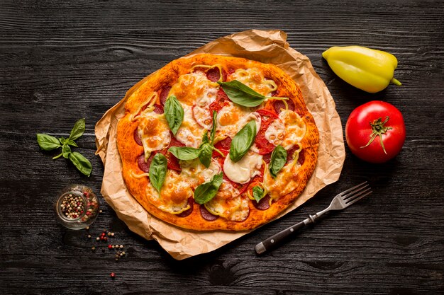 Delicious pizza concept on wooden table