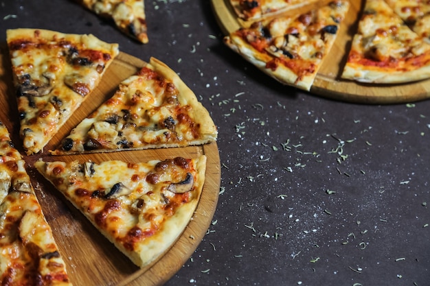 Delicious pizzas with chicken, mushrooms and cheese