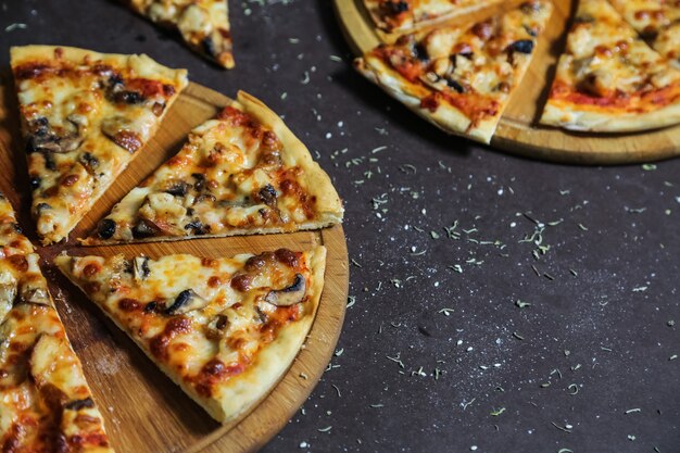 Delicious pizzas with chicken, mushrooms and cheese