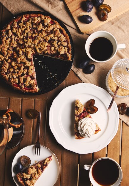 Delicious  Plum pie with Chemex coffee and ingredients with fabric on a wooden table with fabric